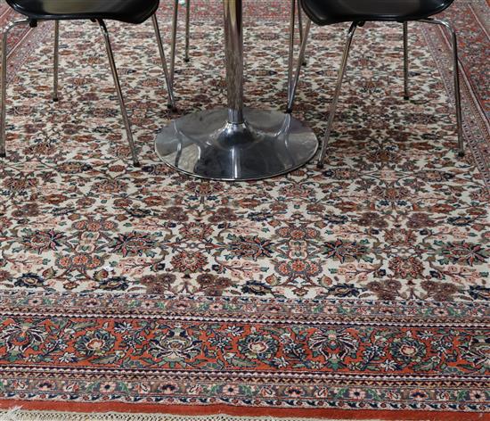 A Persian cream rug 300 x 253cm
